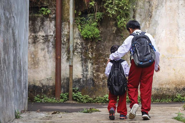 school-boys-in-uniform-with-backpack-